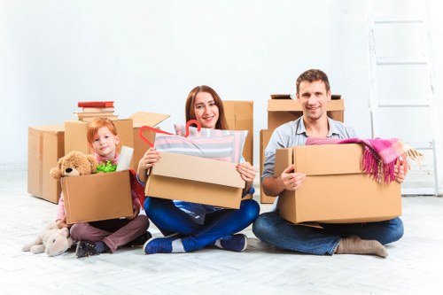 Packed boxes and furniture ready for transport in North Sheen