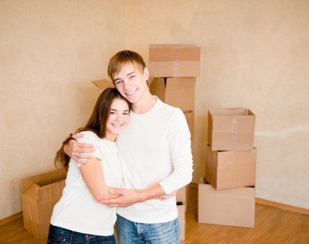 Packed boxes and furniture prepared for transport in North Sheen