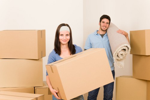 Careful lifting of large furniture from a property entrance