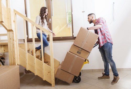 Loading boxes and furniture into a removal van in North Sheen