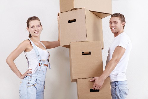 Loading household furniture into a removals van in North Sheen