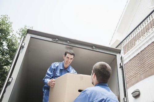 Packed moving boxes ready for a house or office move in North Sheen