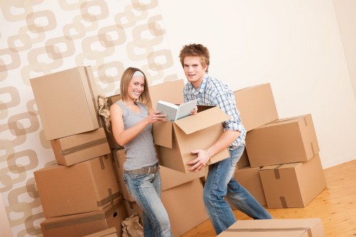 Loading furniture into a moving truck in North Sheen