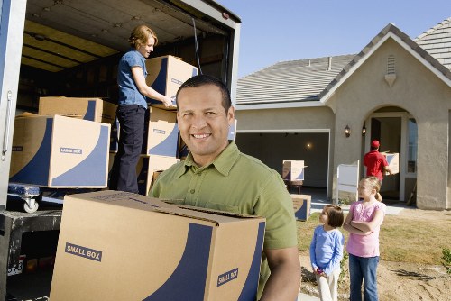 Fragile items and boxes arranged for careful packing during a North Sheen move